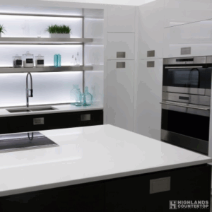 Modern kitchen island featuring a white quartz countertop and contemporary design