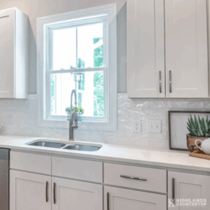 Bright modern kitchen with quartz countertops illuminated by sunlight